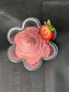 A bowl of strawberry whipped cream